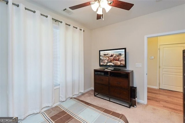 bedroom featuring light wood-type flooring and ceiling fan