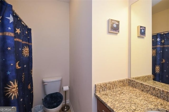 bathroom featuring vanity and toilet