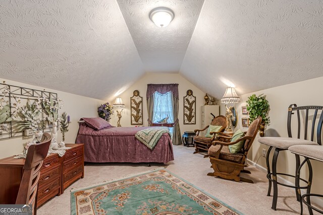 bedroom featuring light colored carpet, lofted ceiling, and a textured ceiling