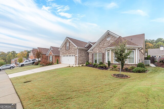 view of front of property featuring a garage and a front lawn