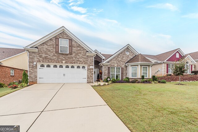 view of front facade with a garage and a front yard