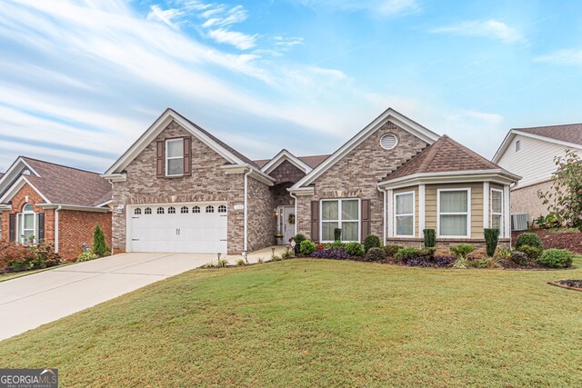 front of property featuring a front yard and a garage