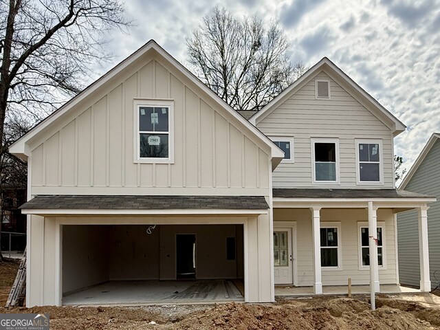 view of front of property with a garage and a front lawn