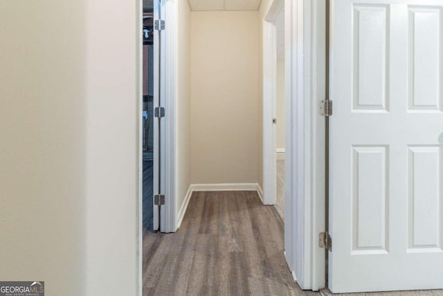 hallway featuring hardwood / wood-style flooring