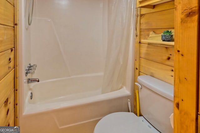 bathroom with toilet and shower / tub combo