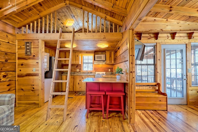 kitchen featuring wooden ceiling, light hardwood / wood-style floors, sink, white appliances, and lofted ceiling with beams