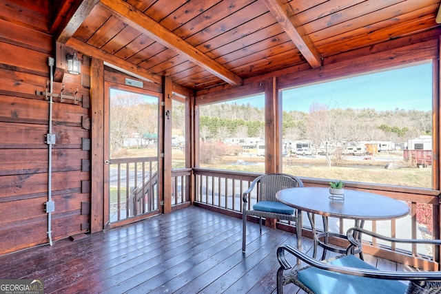 sunroom with beamed ceiling and wood ceiling