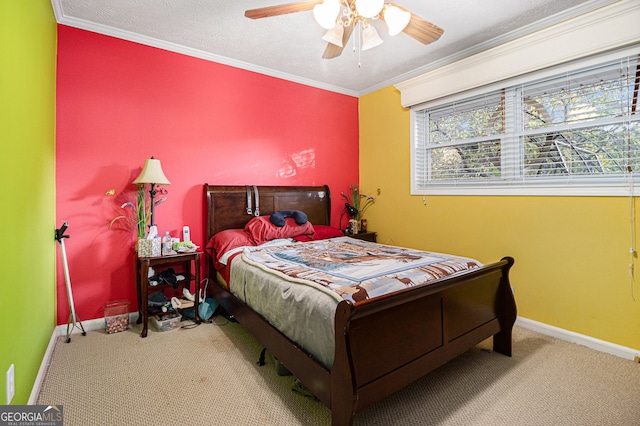 carpeted bedroom featuring ceiling fan and crown molding