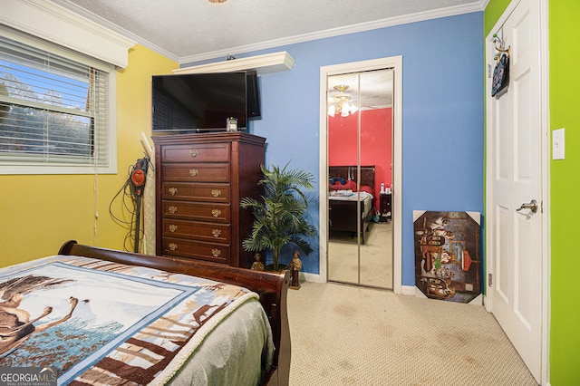 bedroom with a textured ceiling, a closet, crown molding, and carpet