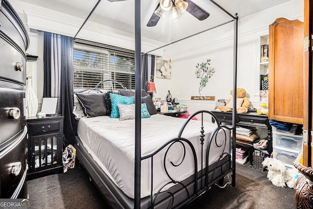 bedroom featuring dark colored carpet and ceiling fan