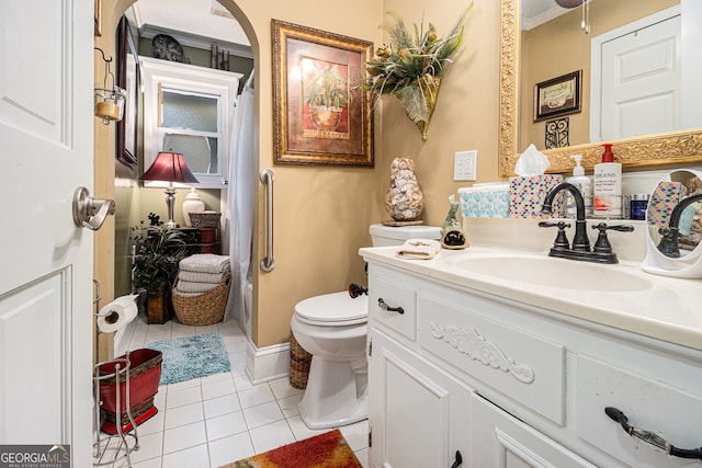 bathroom featuring toilet, vanity, tile patterned flooring, and crown molding