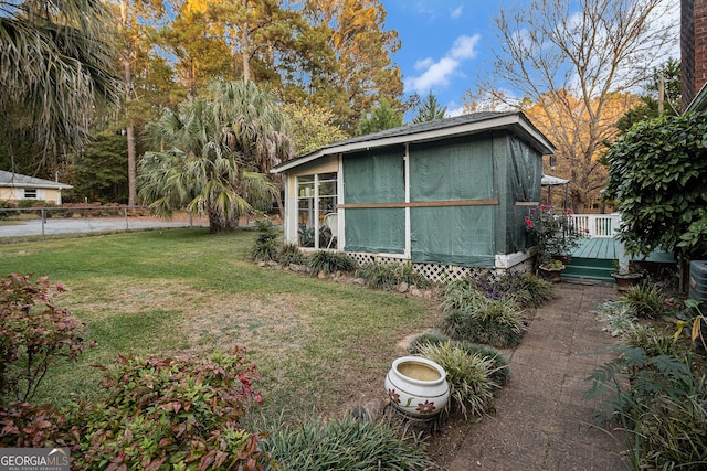 view of yard featuring a wooden deck