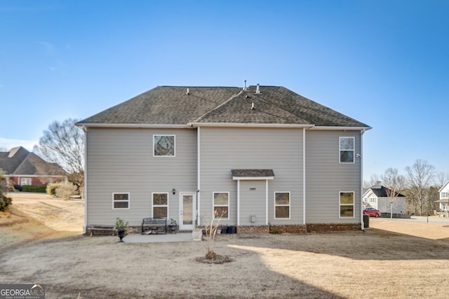 rear view of house with a patio