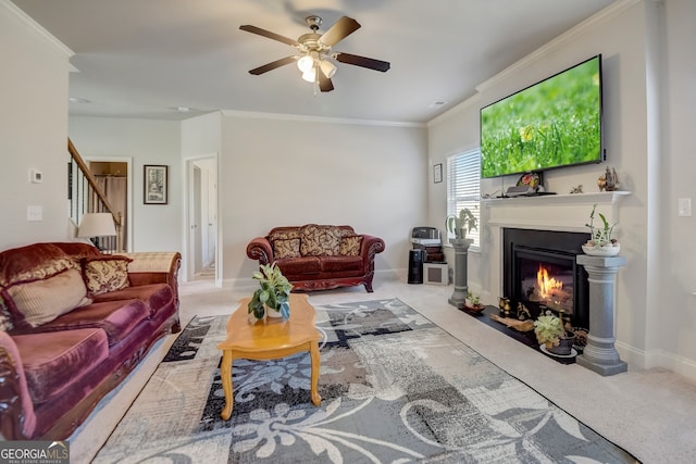 living room featuring light colored carpet, ceiling fan, and crown molding