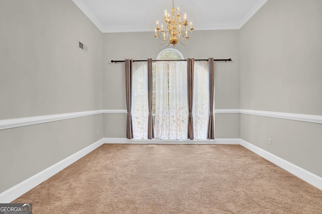 carpeted spare room featuring an inviting chandelier and ornamental molding