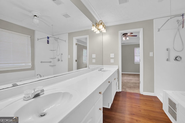 bathroom featuring shower with separate bathtub, vanity, hardwood / wood-style flooring, and ceiling fan