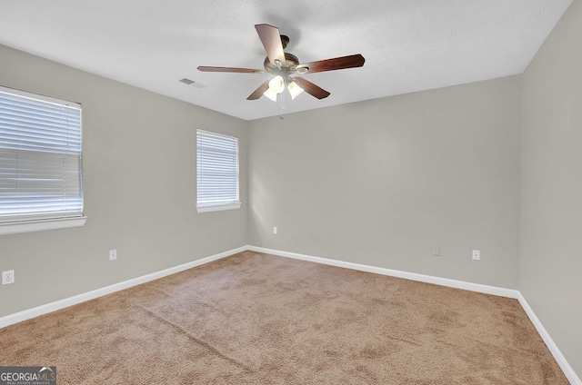 unfurnished room featuring carpet flooring and ceiling fan