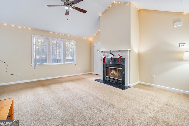 unfurnished living room with baseboards, high vaulted ceiling, a fireplace with flush hearth, ceiling fan, and light colored carpet