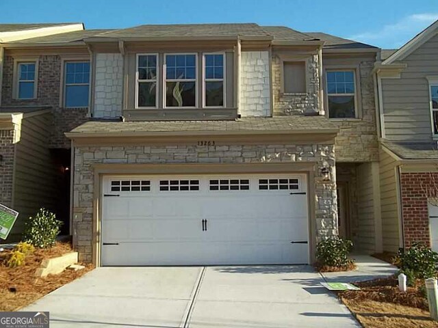 view of front of property with a garage