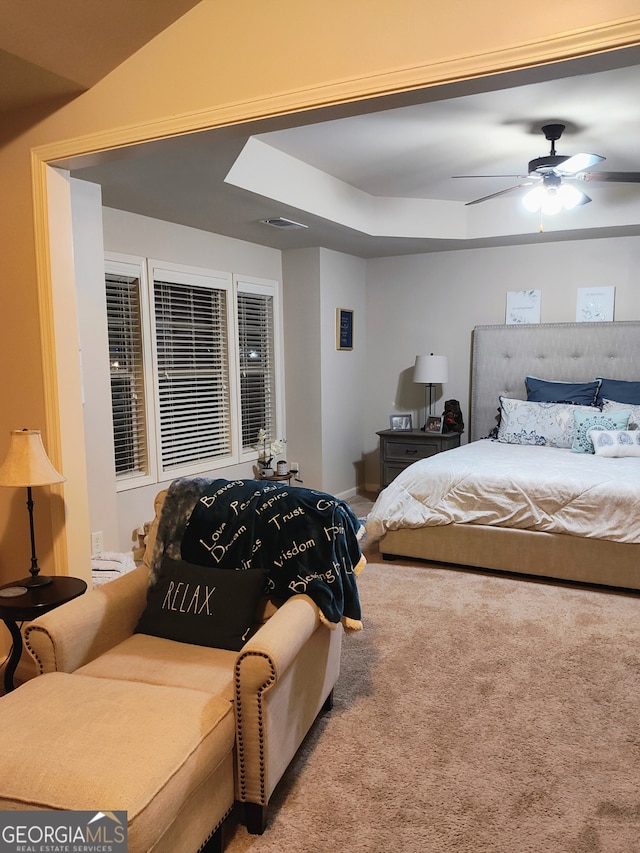 bedroom with a ceiling fan and carpet flooring