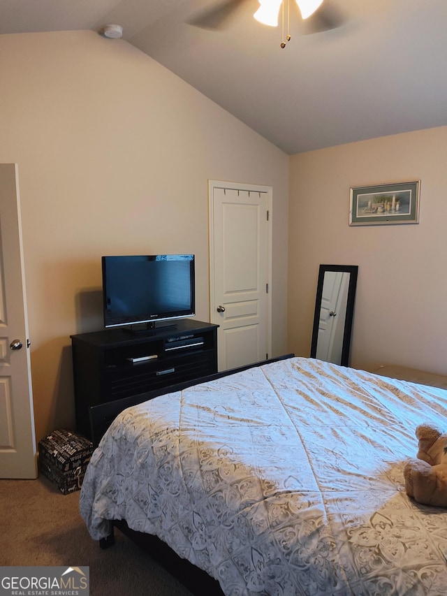 carpeted bedroom featuring vaulted ceiling and ceiling fan