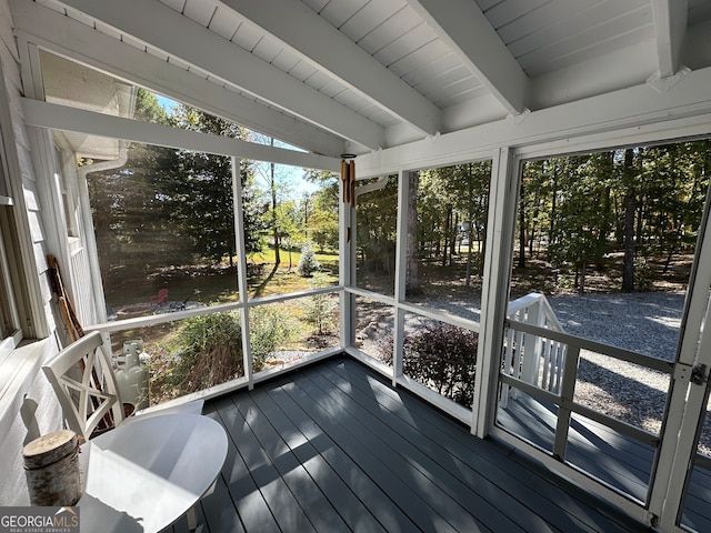 sunroom with beamed ceiling and wood ceiling