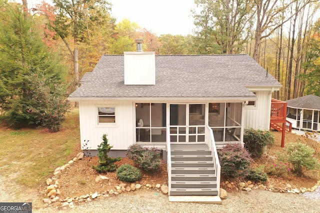 view of front of house with a sunroom