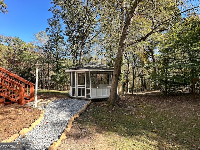 exterior space featuring a sunroom