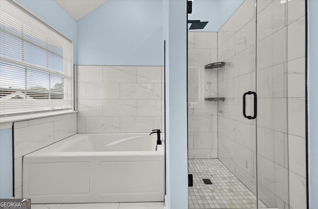 bathroom featuring tile walls, tile patterned flooring, and independent shower and bath