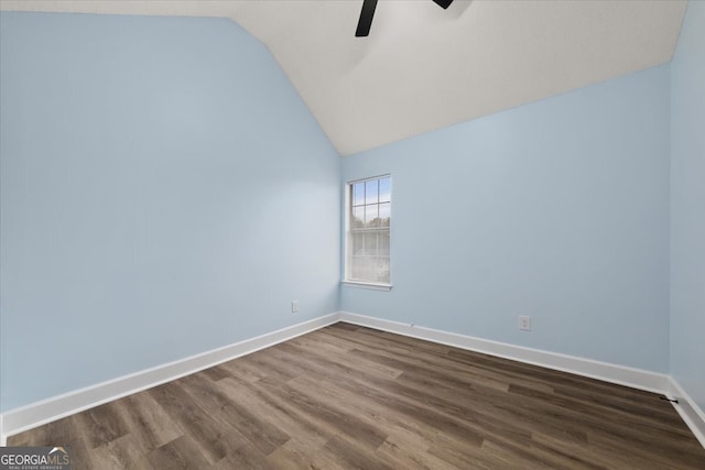 unfurnished room with wood-type flooring, ceiling fan, and vaulted ceiling