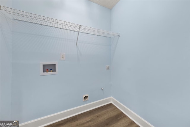 washroom with hardwood / wood-style floors, hookup for a washing machine, and electric dryer hookup