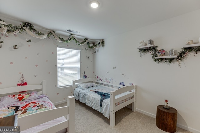 bedroom featuring light carpet