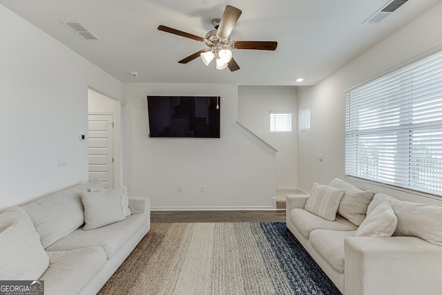 living room featuring hardwood / wood-style floors, plenty of natural light, and ceiling fan