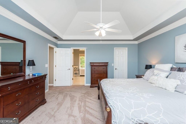 bedroom featuring ceiling fan, light colored carpet, a raised ceiling, and crown molding