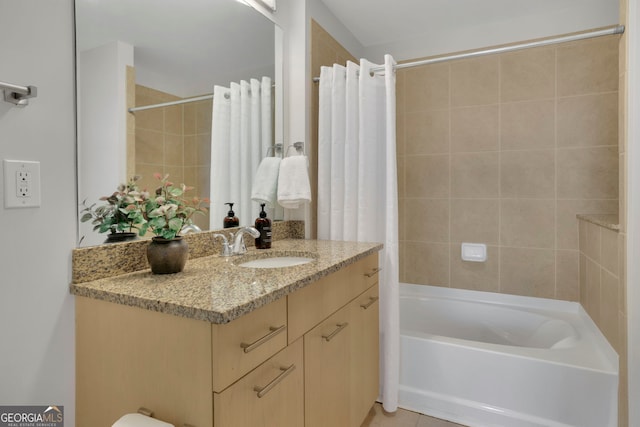 bathroom featuring tile patterned flooring, vanity, and shower / bath combination with curtain