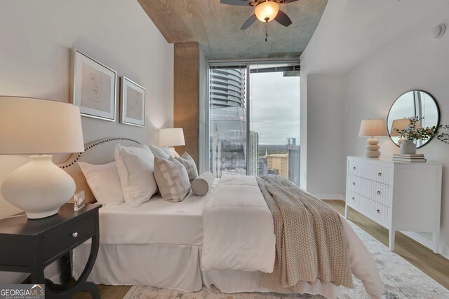 bedroom featuring wood-type flooring and ceiling fan