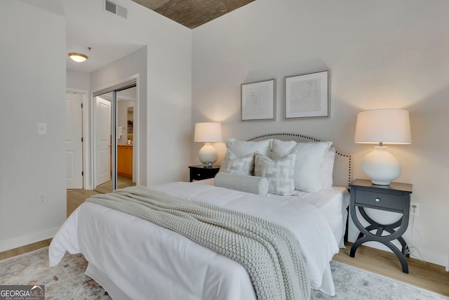 bedroom with a closet and light wood-type flooring