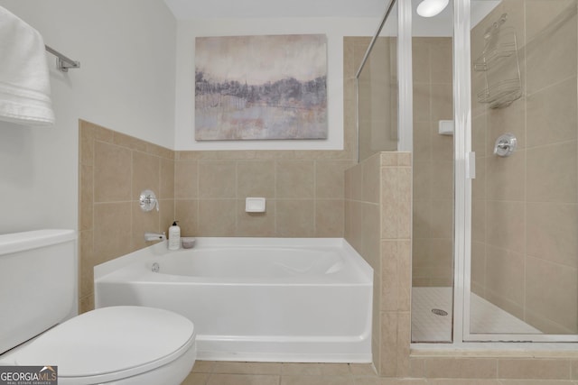 bathroom with independent shower and bath, tile patterned flooring, and toilet