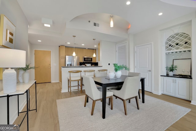 dining space featuring light hardwood / wood-style flooring