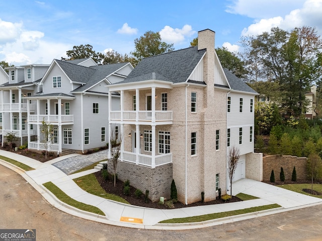 view of home's exterior featuring a balcony and a garage