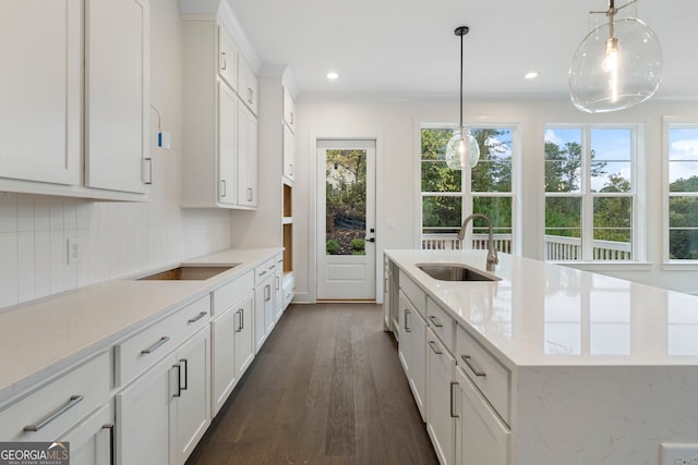 kitchen featuring pendant lighting, sink, and plenty of natural light