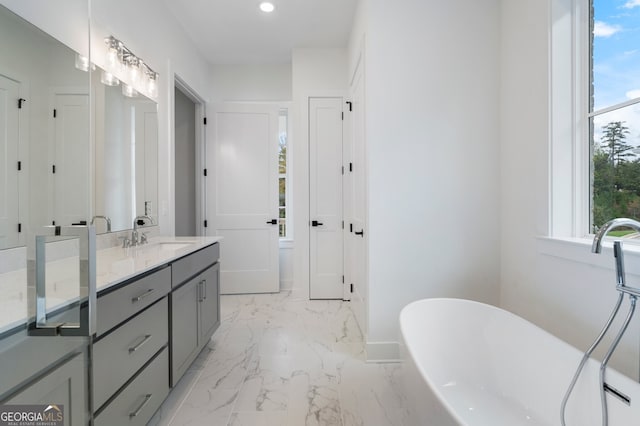 bathroom with a bathtub and vanity