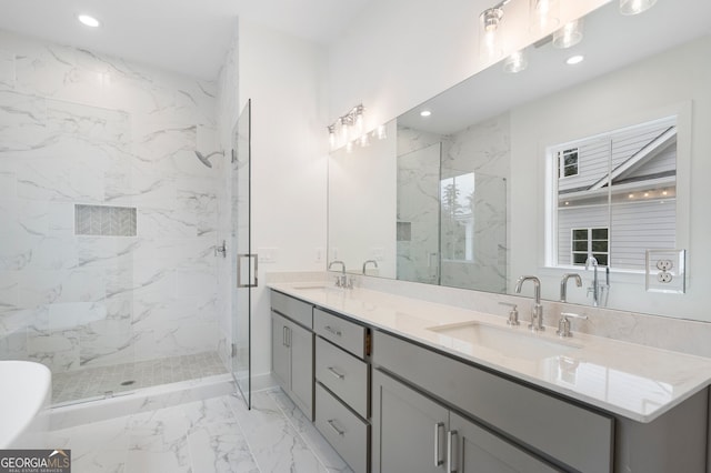 bathroom with vanity and a shower with door