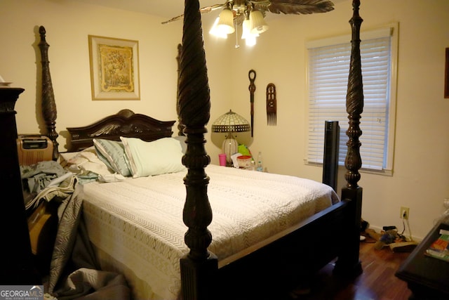 bedroom featuring wood-type flooring and ceiling fan