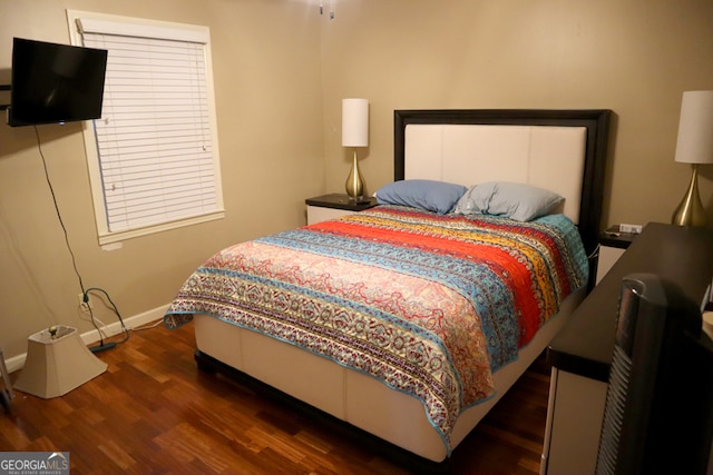 bedroom featuring dark wood-type flooring