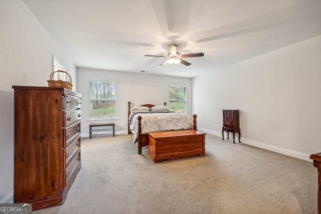 carpeted bedroom with ceiling fan