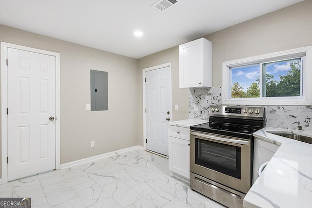 kitchen featuring electric stove, electric panel, light stone countertops, white cabinets, and tasteful backsplash