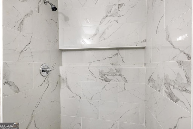 full bathroom with a tile shower