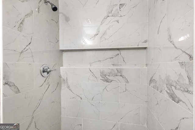bathroom view of tiled shower