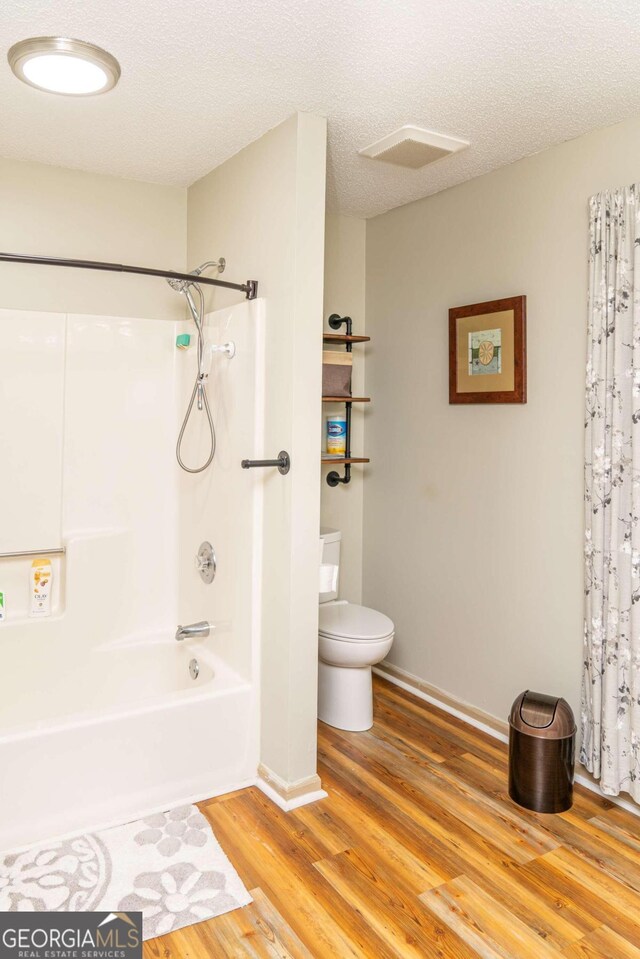 carpeted bedroom featuring ceiling fan and a closet